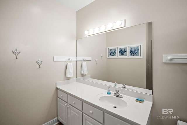 bathroom with baseboards and vanity