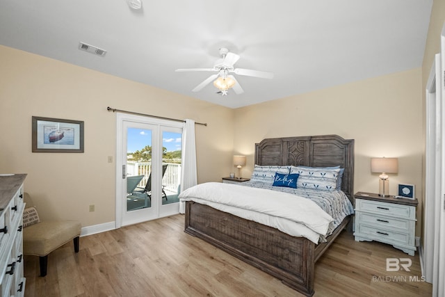 bedroom featuring visible vents, a ceiling fan, access to outside, wood finished floors, and baseboards