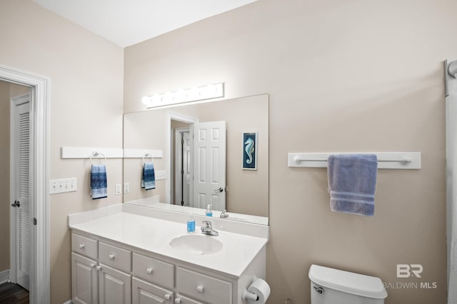 bathroom with vanity and toilet