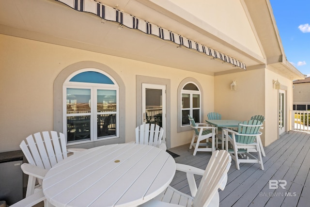 deck featuring outdoor dining area