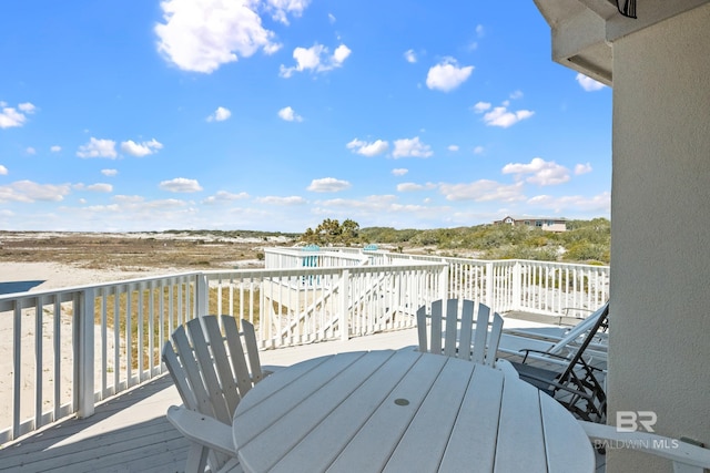 wooden deck with outdoor dining space