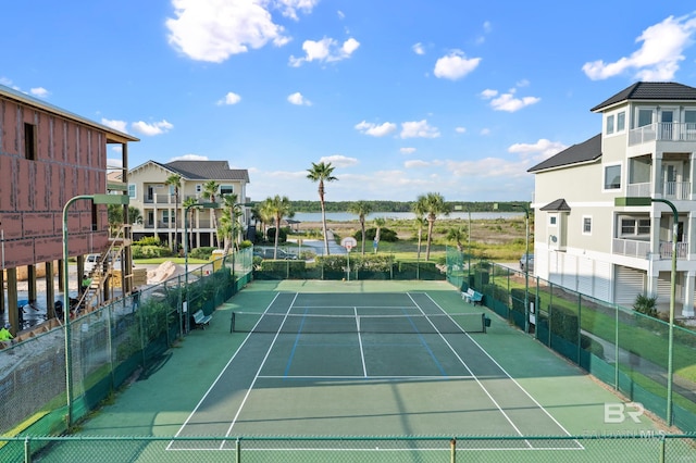 view of sport court featuring fence