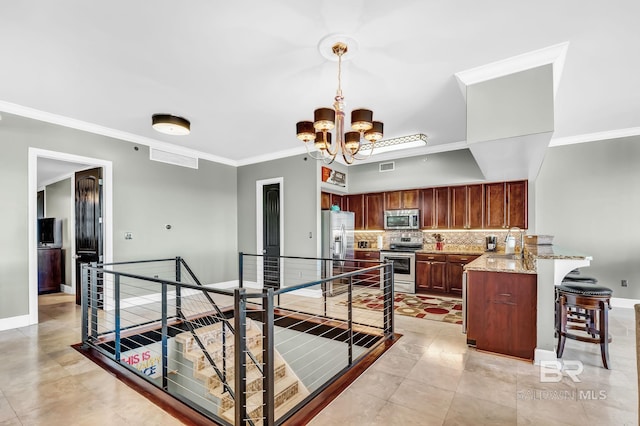 kitchen with stainless steel appliances, tasteful backsplash, a chandelier, a peninsula, and a kitchen breakfast bar