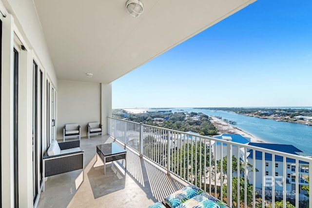 balcony featuring a water view