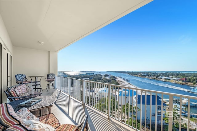 balcony featuring a water view