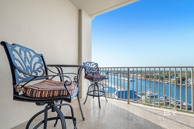 balcony featuring a water view