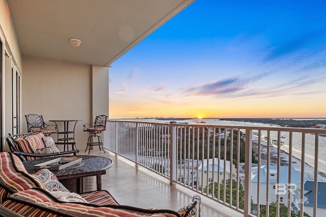 balcony at dusk with a water view