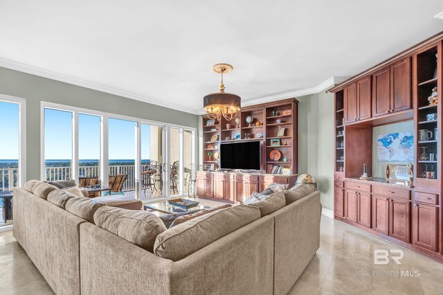 living room featuring a chandelier and ornamental molding