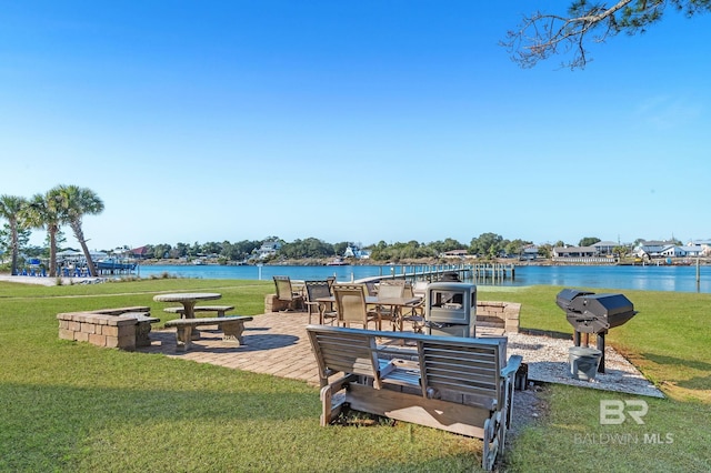 exterior space with a water view and a yard