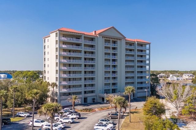 view of property featuring uncovered parking