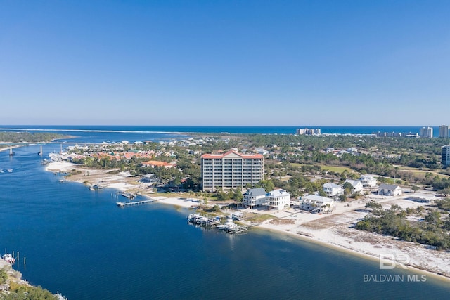 drone / aerial view featuring a water view and a city view