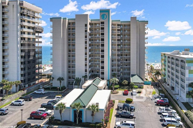 24720 Perdido Beach Blvd Unit 504, Orange Beach, AL 36561 - view of apartment building / complex featuring uncovered parking, a water view, and a city view