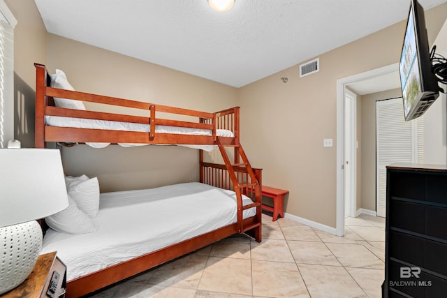24720 Perdido Beach Blvd Unit 504, Orange Beach, AL 36561 - bedroom featuring baseboards and light tile patterned floors