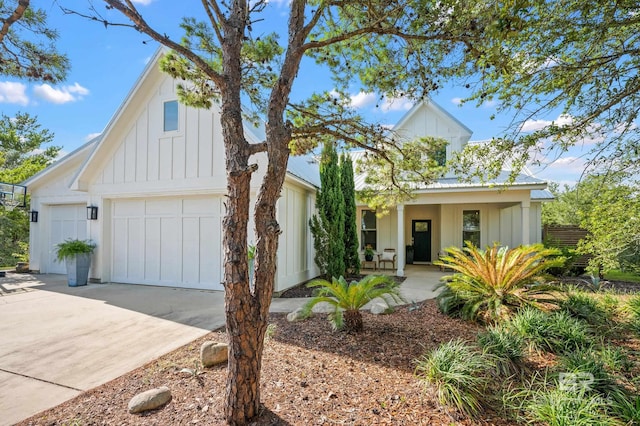 30531 Ono N Loop W, Orange Beach, AL 36561 - modern inspired farmhouse with board and batten siding, driveway, and a porch