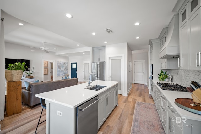 30531 Ono N Loop W, Orange Beach, AL 36561 - kitchen featuring appliances with stainless steel finishes, a breakfast bar, recessed lighting, light countertops, and ceiling fan