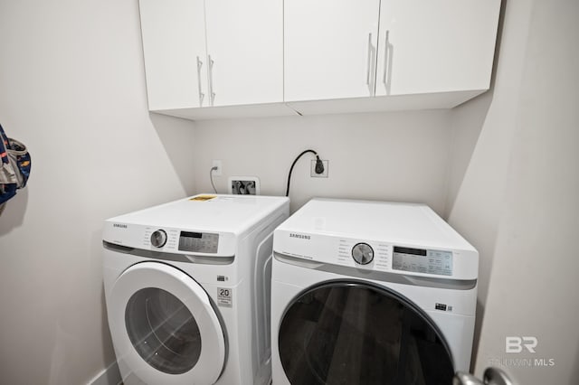 30531 Ono N Loop W, Orange Beach, AL 36561 - laundry room with washing machine and dryer and cabinet space
