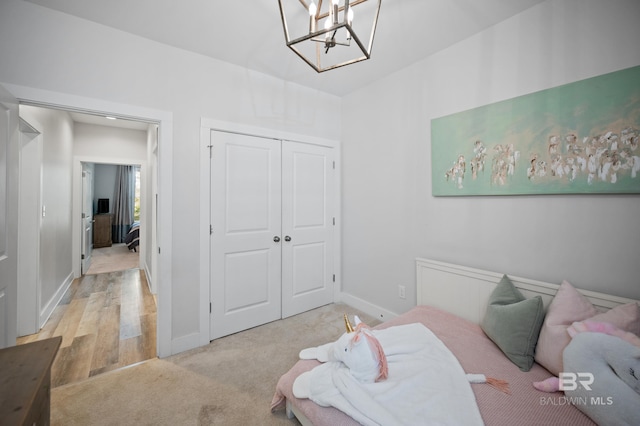 30531 Ono N Loop W, Orange Beach, AL 36561 - bedroom featuring a chandelier, a closet, and light colored carpet