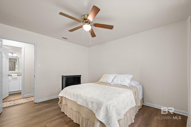 169 Buena Vista Dr, Daphne, AL 36526 - bedroom featuring wood finished floors, baseboards, and ensuite bath