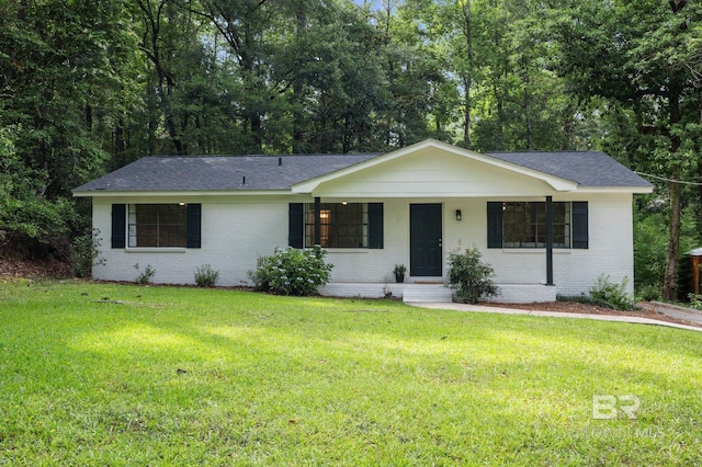 169 Buena Vista Dr, Daphne, AL 36526 - ranch-style house featuring brick siding, a front lawn, and roof with shingles