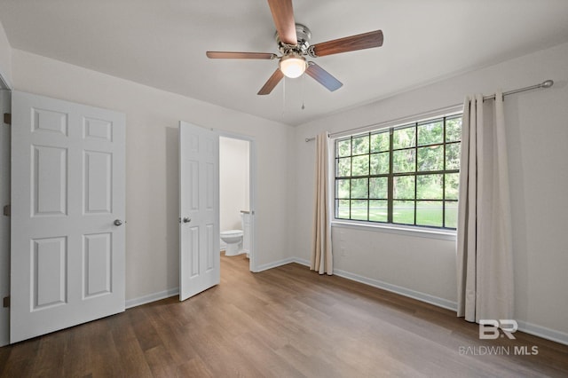 169 Buena Vista Dr, Daphne, AL 36526 - unfurnished bedroom with wood finished floors, baseboards, a ceiling fan, and ensuite bath