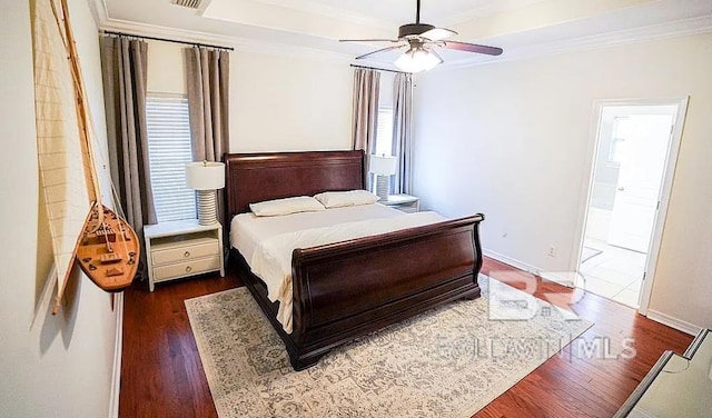 bedroom with dark wood-type flooring, ceiling fan, ornamental molding, and ensuite bathroom