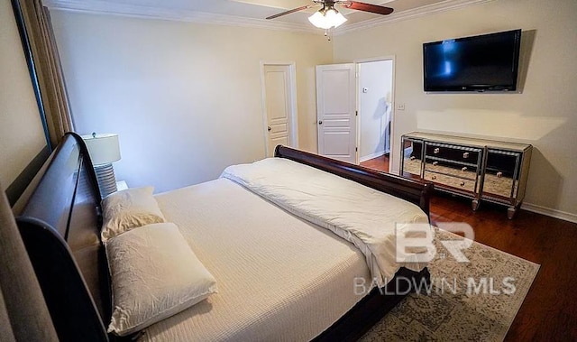 bedroom with ceiling fan, dark hardwood / wood-style flooring, and ornamental molding