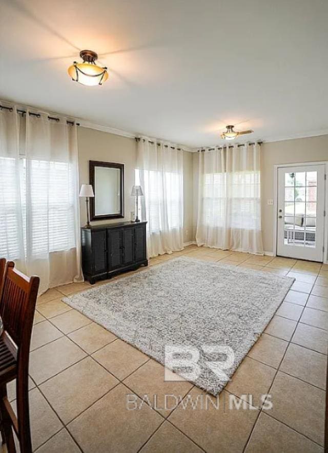 tiled living room with crown molding