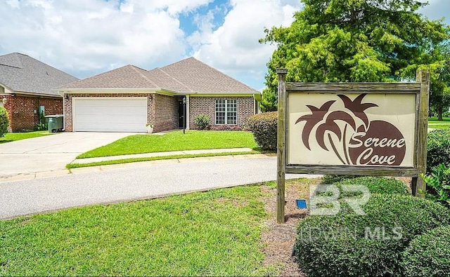 view of front of home featuring a garage and a front lawn