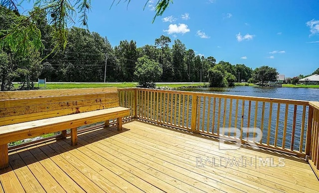 wooden terrace with a water view