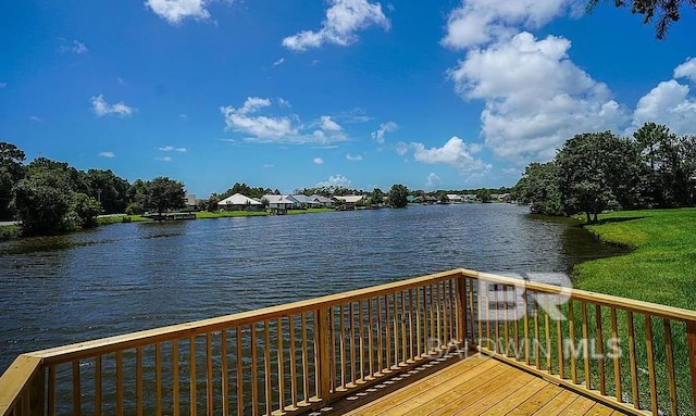 exterior space featuring a water view and a lawn