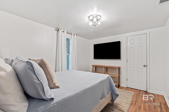 bedroom featuring hardwood / wood-style flooring