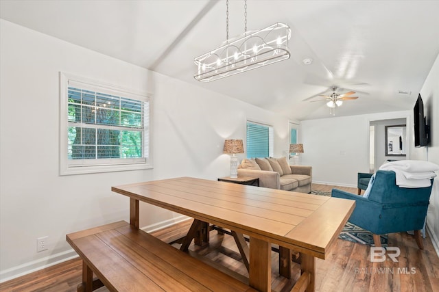 dining space with hardwood / wood-style flooring and ceiling fan