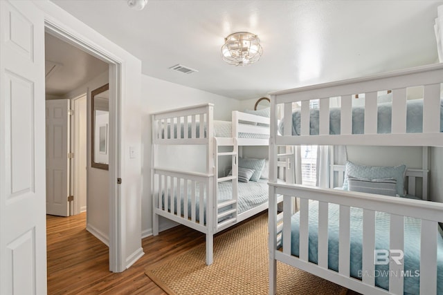 bedroom with hardwood / wood-style floors