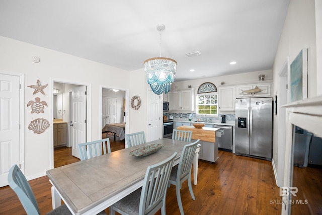 5601 State Highway 180 Unit 2802, Gulf Shores, AL 36535 - dining space with dark wood-style floors, a chandelier, and recessed lighting