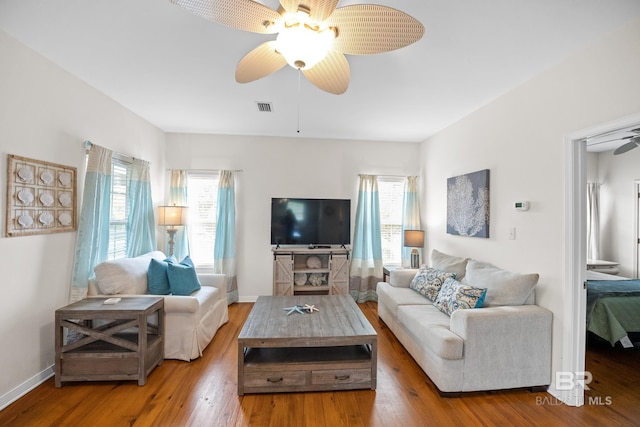 5601 State Highway 180 Unit 2802, Gulf Shores, AL 36535 - living room featuring ceiling fan, wood finished floors, and baseboards