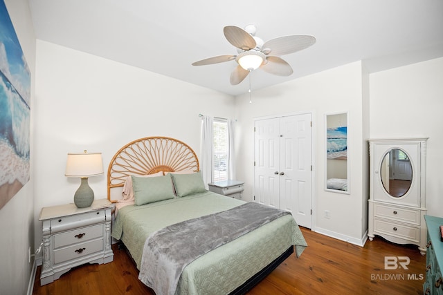 5601 State Highway 180 Unit 2802, Gulf Shores, AL 36535 - bedroom with wood finished floors, a closet, a ceiling fan, and baseboards