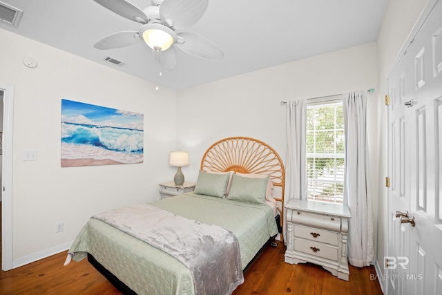 5601 State Highway 180 Unit 2802, Gulf Shores, AL 36535 - bedroom with wood finished floors, a ceiling fan, and baseboards