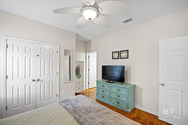 5601 State Highway 180 Unit 2802, Gulf Shores, AL 36535 - bedroom featuring wood finished floors, a closet, baseboards, and ceiling fan
