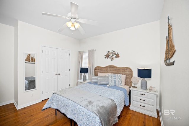 5601 State Highway 180 Unit 2802, Gulf Shores, AL 36535 - bedroom featuring a closet, baseboards, wood finished floors, and a ceiling fan