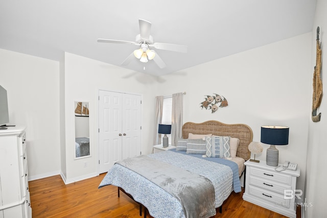 5601 State Highway 180 Unit 2802, Gulf Shores, AL 36535 - bedroom with wood finished floors, a closet, baseboards, and a ceiling fan
