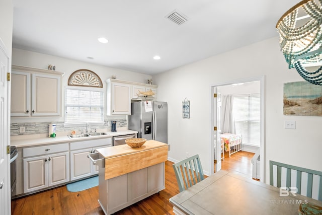 5601 State Highway 180 Unit 2802, Gulf Shores, AL 36535 - kitchen with a sink, stainless steel appliances, healthy amount of natural light, backsplash, and recessed lighting