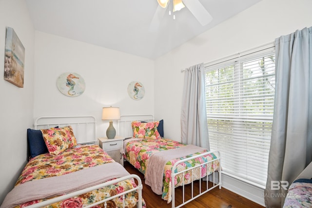5601 State Highway 180 Unit 2802, Gulf Shores, AL 36535 - bedroom featuring wood finished floors, ceiling fan, and baseboards