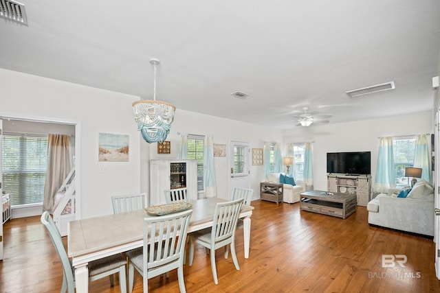 5601 State Highway 180 Unit 2802, Gulf Shores, AL 36535 - dining space with wood finished floors, a chandelier, and ceiling fan
