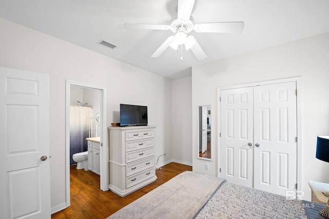 5601 State Highway 180 Unit 2802, Gulf Shores, AL 36535 - bedroom featuring a closet, dark wood-style floors, ceiling fan, and ensuite bath