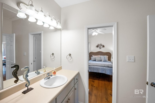 5601 State Highway 180 Unit 2802, Gulf Shores, AL 36535 - bathroom featuring vanity, ensuite bath, a ceiling fan, and wood finished floors
