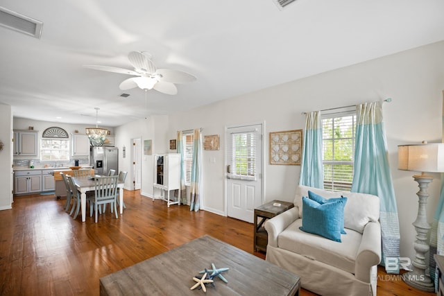 5601 State Highway 180 Unit 2802, Gulf Shores, AL 36535 - living area with plenty of natural light, ceiling fan, and dark wood-type flooring