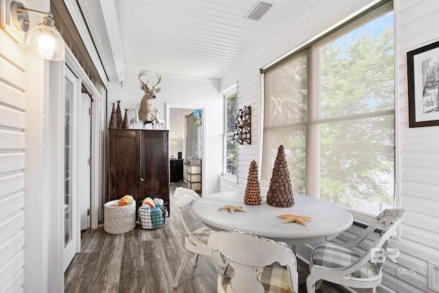 dining space with wood-type flooring