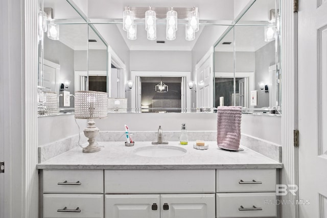 bathroom with vanity and crown molding