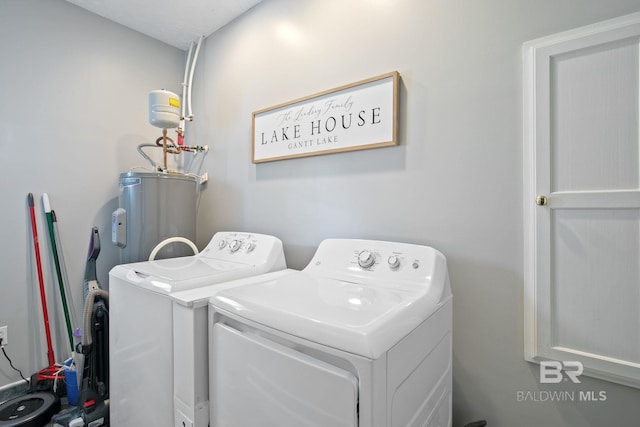 washroom with washer and dryer and electric water heater