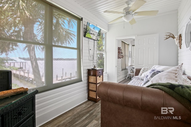 sunroom / solarium featuring ceiling fan, a healthy amount of sunlight, and wooden ceiling